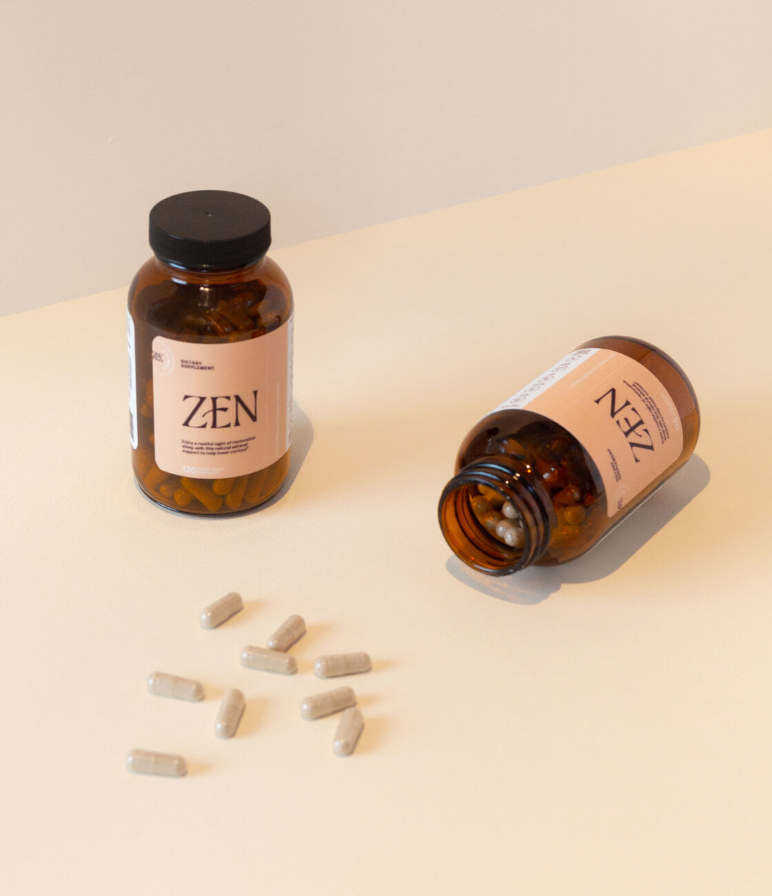 Zen comes with 120 capsules, enough to take 2 capsules a day for a few months when used as directed. [AD: 2 bottles of Zen on a plain cream backdrop and shown. 1 bottle is open with a few pills scattered on the tabletop]
