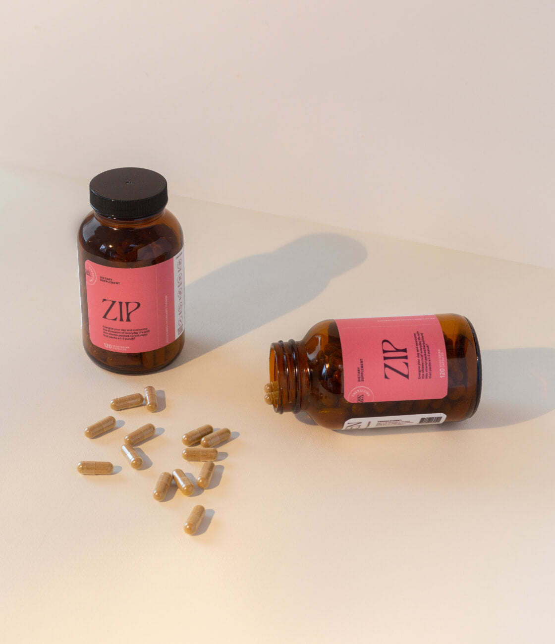 Zip comes with 120 capsules, enough to take 2 capsules a day for 1–2 months when used as directed.  [AD: 2 bottles of zip on a plain cream backdrop and shown. 1 bottle is open with a few pills scattered on the tabletop]